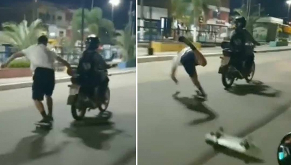 Jovem anda de skate segurando traseira de moto e leva tombo no centro de Cruzeiro do Sul; assista